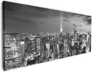 Wallario Premium Leinwandbild New York bei Nacht - Panoramablick über die Stadt - schwarzweiß in Größe 50 x 125 cm