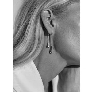 Elegante lava Ohrringe - Silbernes minimalistisches fließendes Design