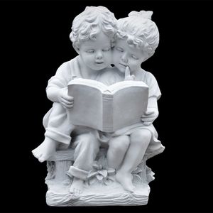 Massive Steinfigur I Junge und Mädchen lesen in einem Buch