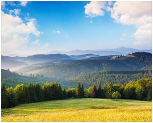 Wallario Poster - Berglandschaft im Gebirge unter blauem Himmel, Kunstdruck Größe: 40 x 50 cm