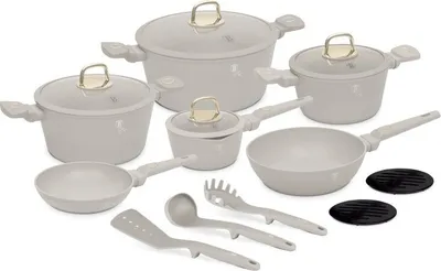 A collection of cookware and utensils arranged on a white background.