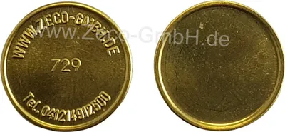Two golden tokens are shown side-by-side. The left token has text and numbers embossed on it, while the right token is blank.
