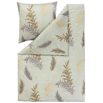 A folded duvet cover and a pillowcase with a fern leaf pattern.