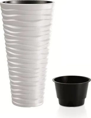 A white planter with a wavy texture and a black inner pot are shown against a white background.