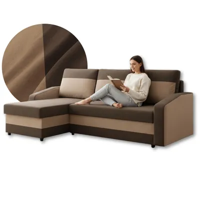 A woman is reading a book while sitting on a sectional sofa.