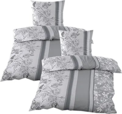 A stack of bedding sets with a floral and striped pattern.