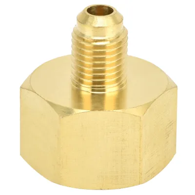 A close-up studio shot of a brass adapter fitting.
