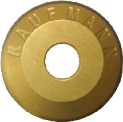 A close-up, centered shot of a gold-colored circular metal disc with a hole in the middle.