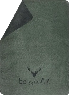 A green blanket with a deer head graphic and the text 'be wild'.