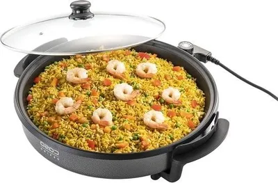 An electric party pan filled with paella, with a glass lid slightly ajar.