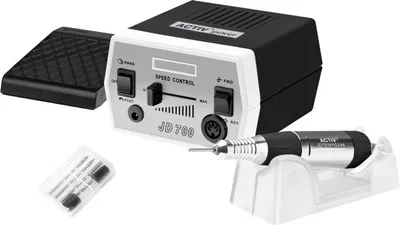A nail drill machine with its accessories, including a foot pedal and drill bits, displayed on a white background.