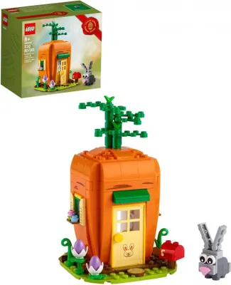 A LEGO set of a carrot house with a bunny and a mailbox, shown with its packaging.