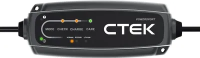 A CTEK CT5 Powersport battery charger is shown against a white background. The charger has indicator lights and text labels.