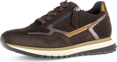 A side view of a brown women's sneaker with a zipper detail.