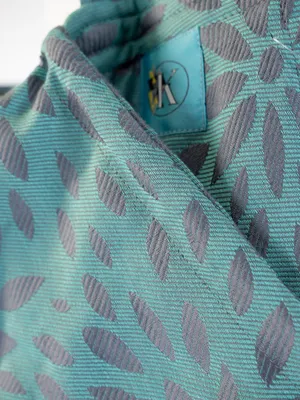 Produktbild von KAAMI | BuckleTai | komfortable Babytrage | Flora Celadon – Mint