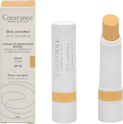 A box and two concealer sticks are displayed against a white background.