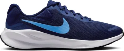 A side view of a blue Nike running shoe with a white sole, isolated on a white background.