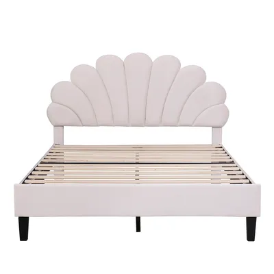 A white upholstered bed frame with a scalloped headboard and wooden slats for mattress support, shown against a white background.