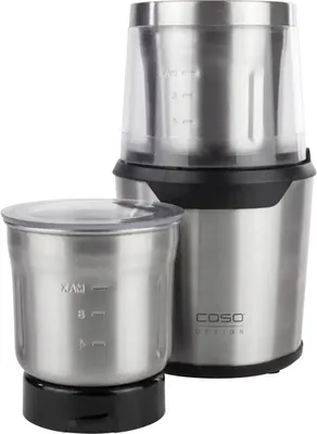 A stainless steel multi-chopper with two detachable containers is shown against a white background. The main unit has a clear lid with measurement markings, and a separate container with a clear lid is placed in front of it. The brand logo 'CASO DESIGN' is