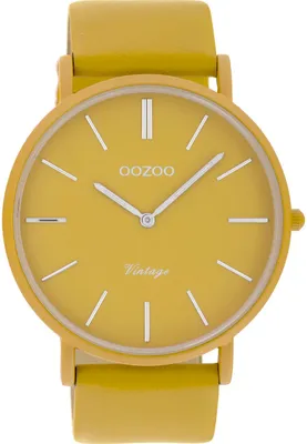 A close-up studio shot of a yellow wristwatch.