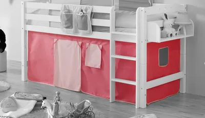 A loft bed with pink curtains and a small shelf with a stuffed animal.