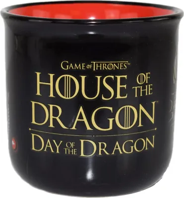 A black ceramic mug with gold lettering and a red interior.
