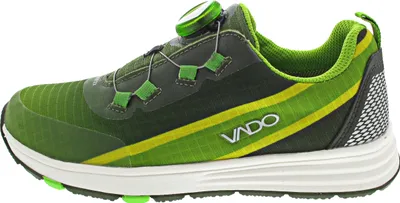A side view of a green and yellow athletic shoe with a white sole.