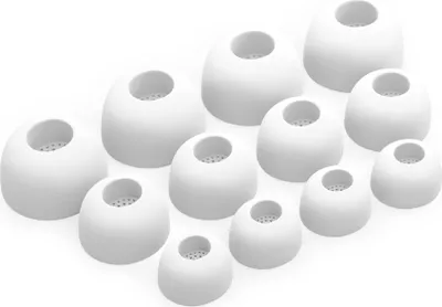 A collection of white silicone earbud tips of various sizes arranged on a white background.