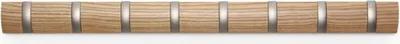 A row of eight wooden coat hooks with silver accents against a white background.