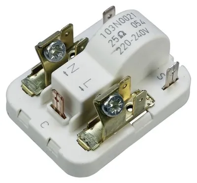A close-up view of an electronic component with metal contacts and white plastic housing.