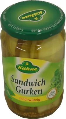 A jar of pickles on a white background.