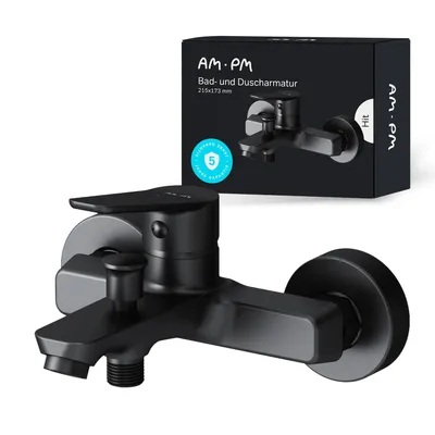 A black bathroom faucet is shown in front of its packaging.