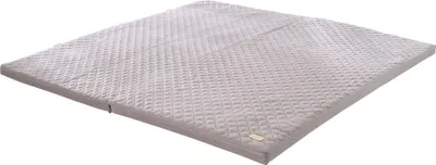 A folded mattress on a white background.