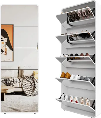 A white shoe cabinet with multiple flip-out drawers, some of which contain shoes. A mirrored panel on the left side reflects a living room scene.