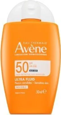 A product shot of an orange sunscreen bottle with a white cap.