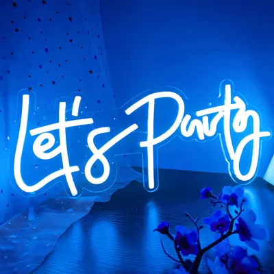 A neon sign that says "Let's Party" is displayed against a blue background with some fabric and flowers.