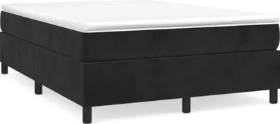 A black boxspring bed frame with a white mattress topper, shown from a side angle on a white background.