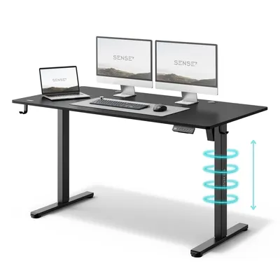 A black adjustable height desk with two computer monitors, a laptop, keyboard, and mouse.