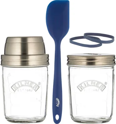 A sourdough starter kit with two jars, a spatula, and bands.