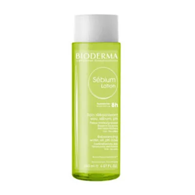 A product shot of a green bottle of Bioderma Sebium Lotion against a white background.