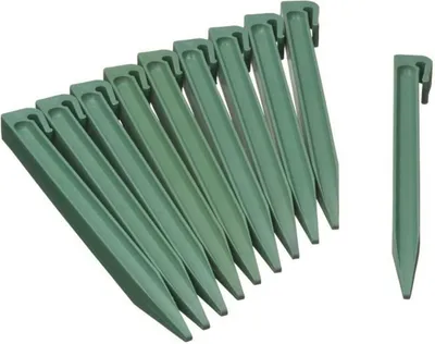 A group of green garden stakes arranged diagonally, with one stake placed separately to the right.