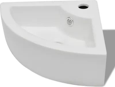 A white corner sink is shown from a slightly elevated angle against a white background.