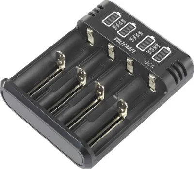 A black battery charger with four slots for batteries. The top of the charger has indicators for battery charge levels.