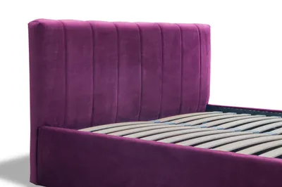 Close-up view of a purple velvet upholstered bed frame with a slatted mattress base.