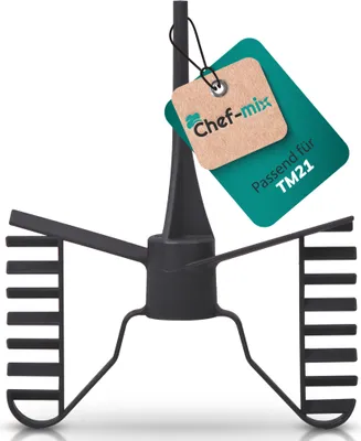 A black kitchen mixer attachment with two tags attached to it, one brown and one teal.