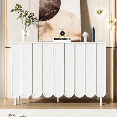 A white sideboard with decorative doors is shown in a room setting.