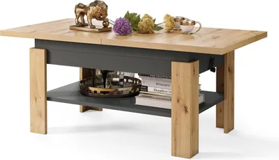 A coffee table with a wooden top and gray base, decorated with a lion statue, flowers, and cups.
