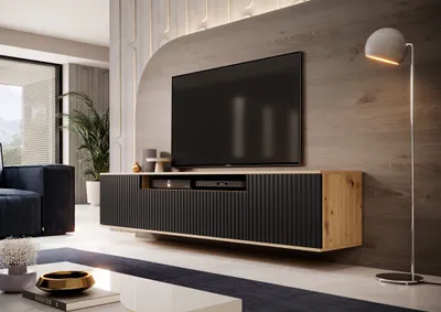 A modern living room with a TV stand and a large television.