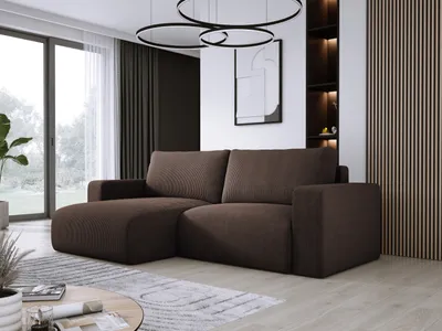 A modern living room with a dark brown sectional sofa, large windows, and decorative wall paneling.