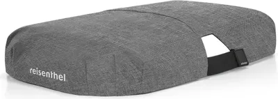 A grey fabric cover for a shopping bag or basket, with a black strap detail and a cut-out opening.